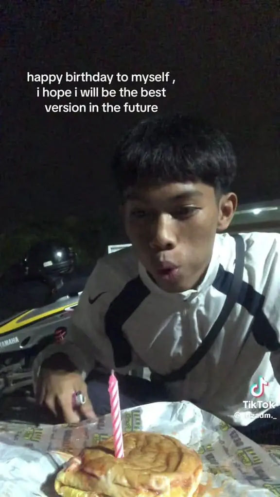 17yo msian boy blowing a candle