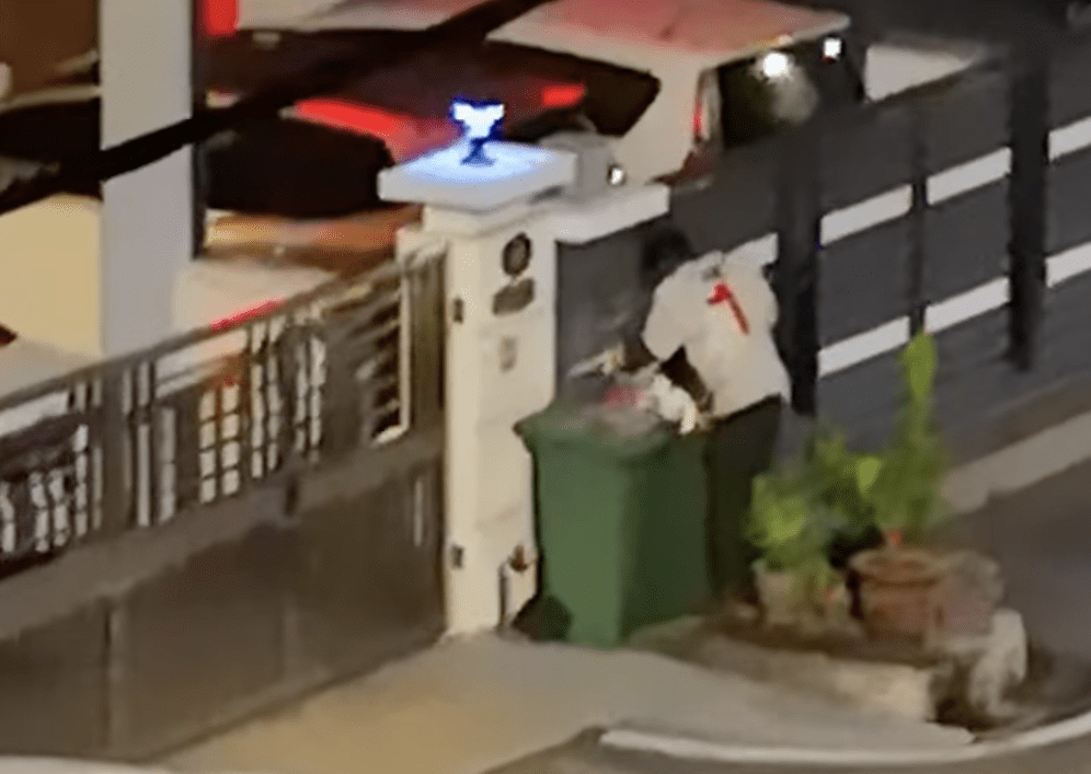 Desperate times: Man scavenges for food from rubbish bin at 3am
