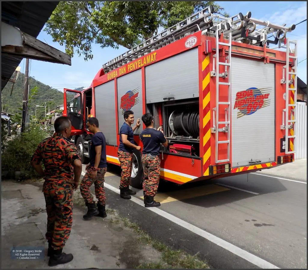 Firefighters and their truck