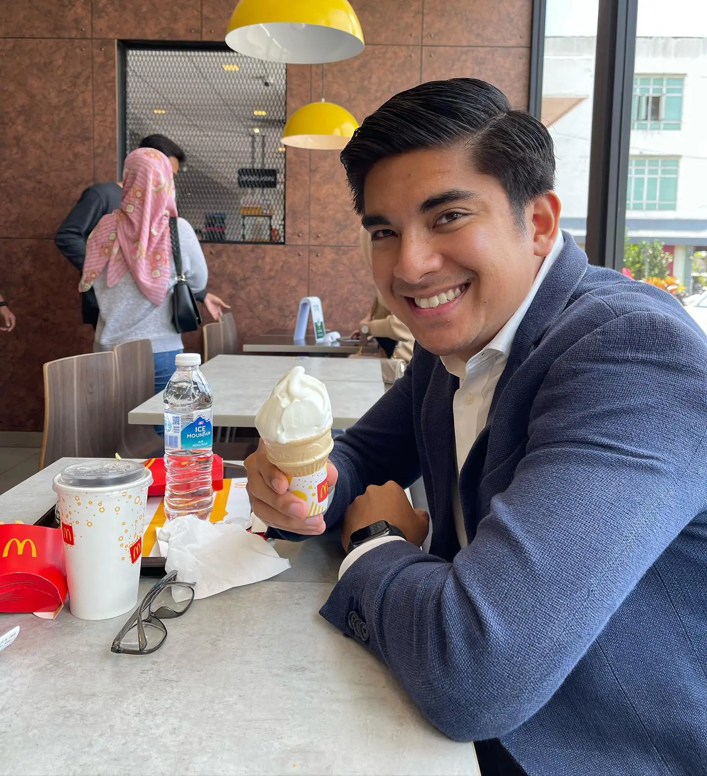 Syed Saddiq eating ice cram from McDonald's 