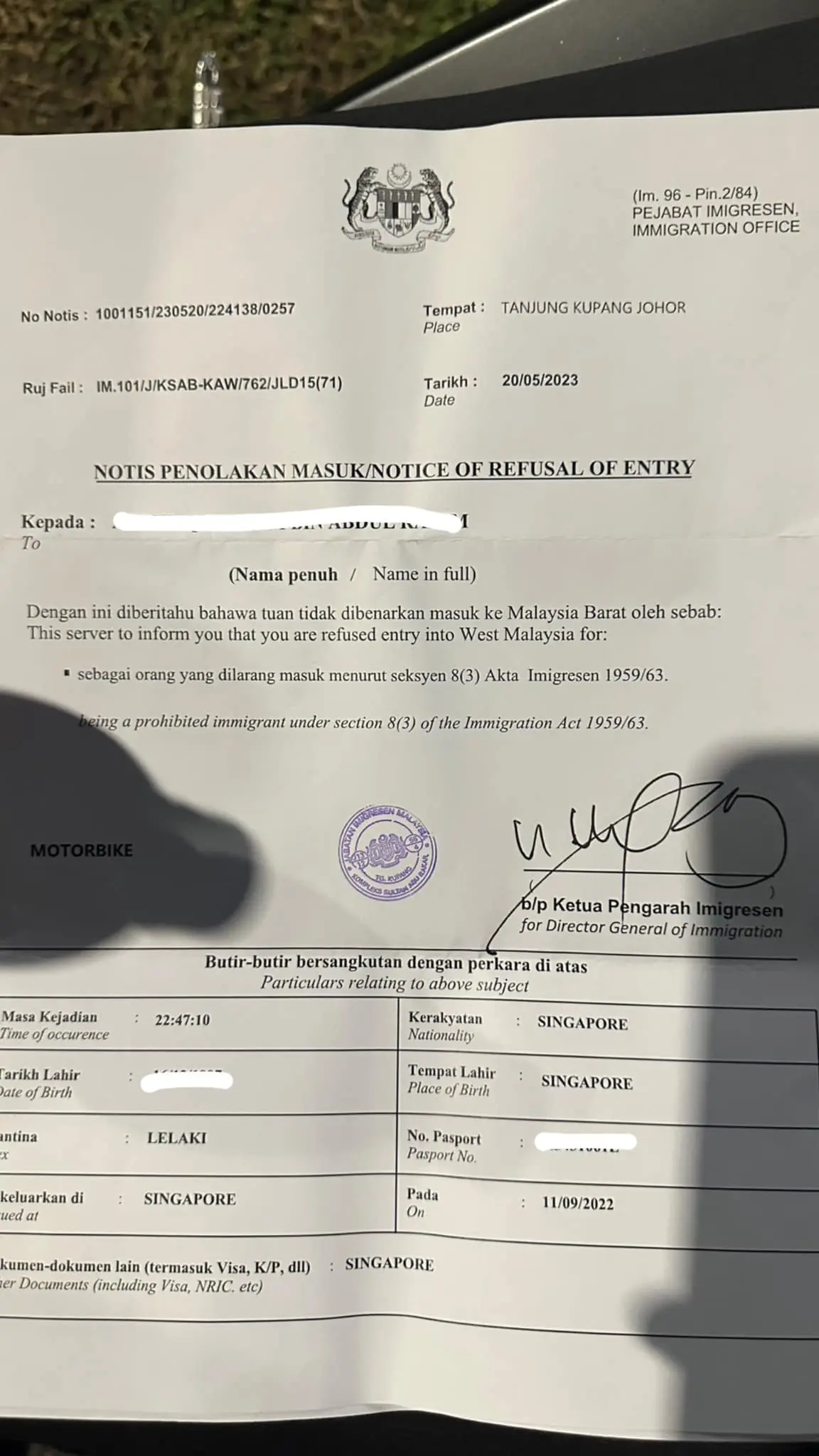 Refusal of Entry notice issued to the Sg couple.