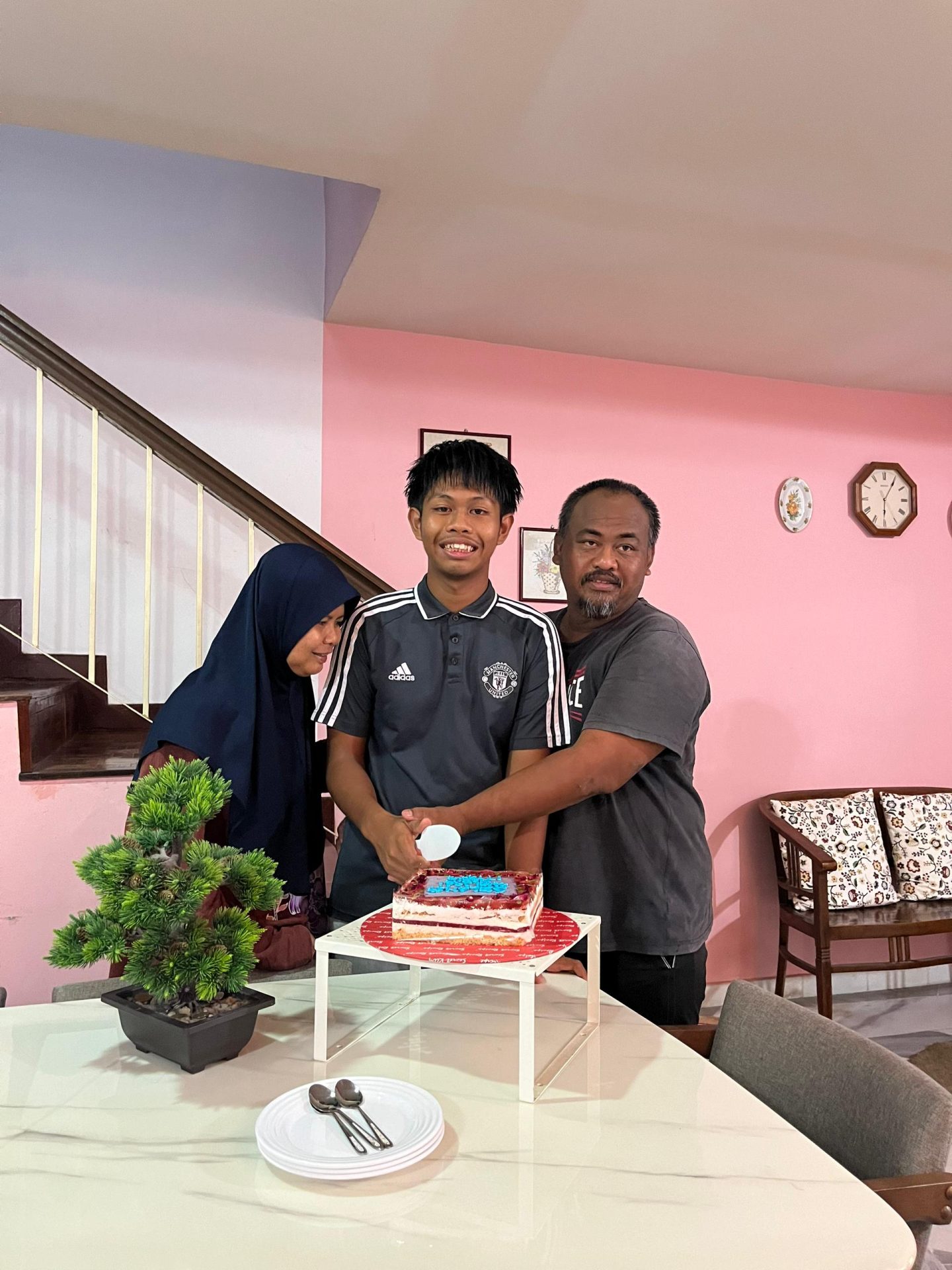 Nabil and Parents Cutting his 17th Birthday Cake