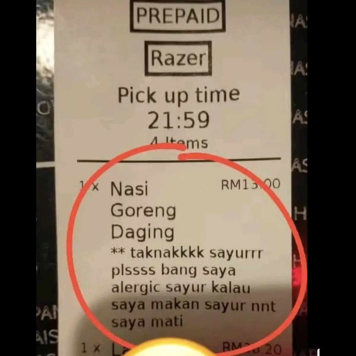 a receipt showing a customer requesting no vegetables be added to the fried rice. 