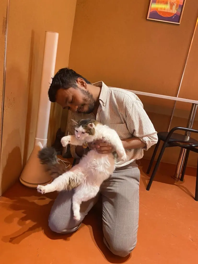 Holding Poppy Kat Cafe's cat