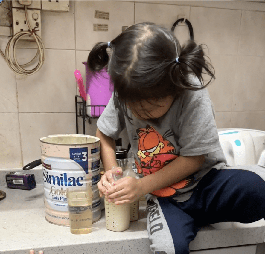 6yo girl making milk for sisters