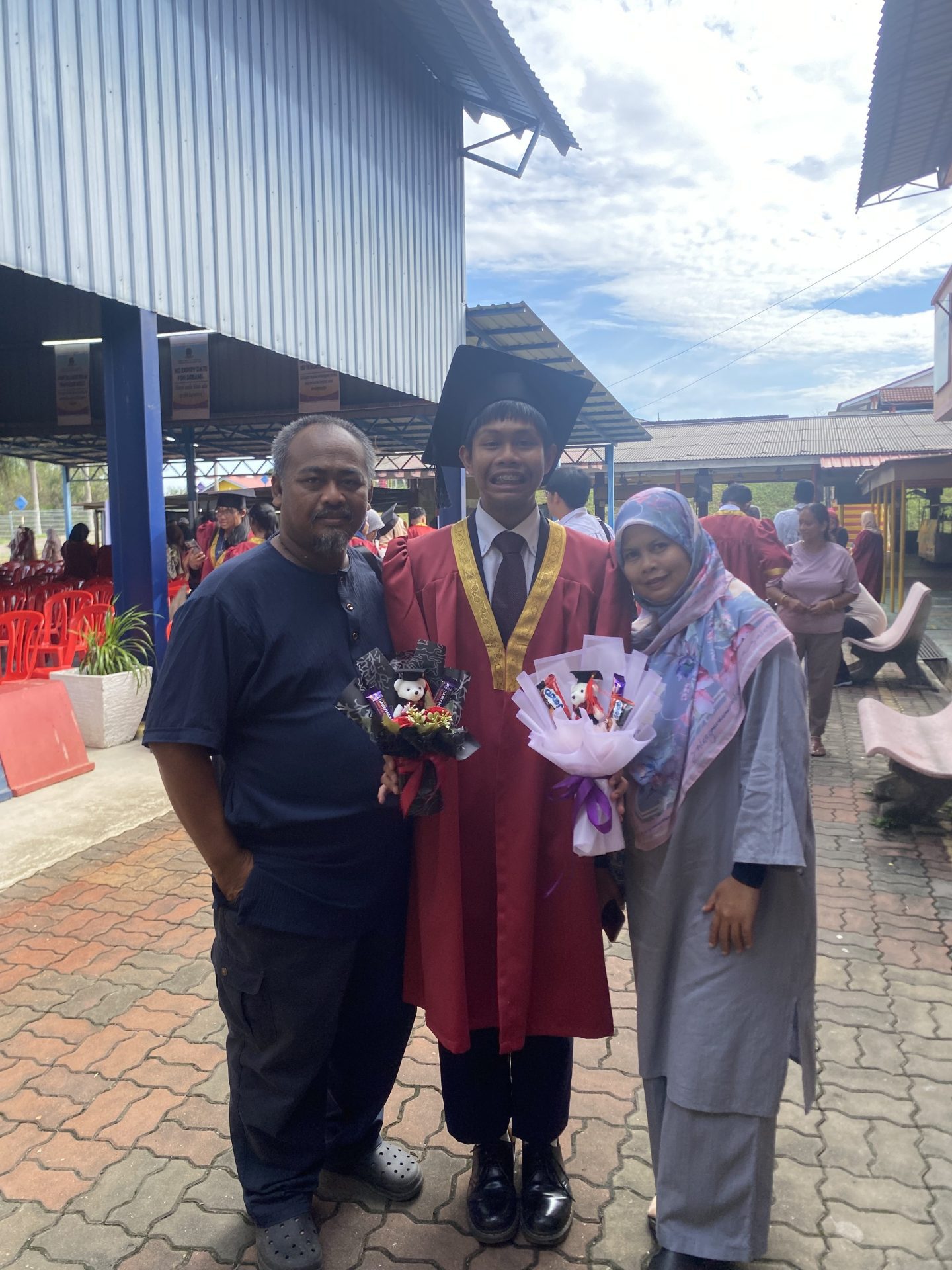 Nabil and his family at his graduation ceremony
