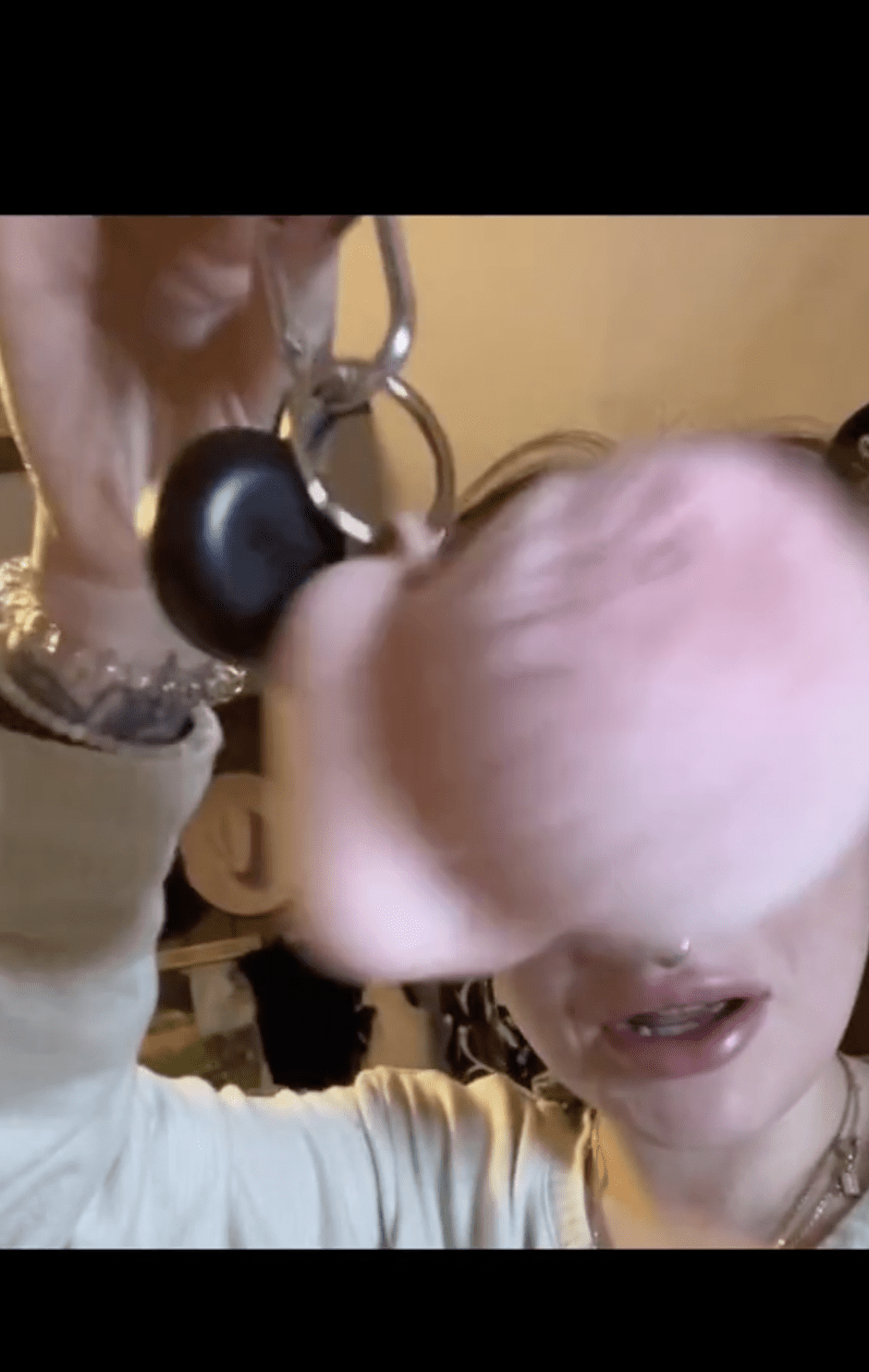 Carli B showcasing her AirPods in TikTok Vide