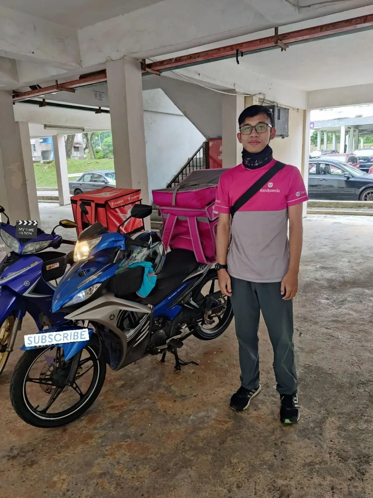 Fauzan Hasany working as foodpanda rider