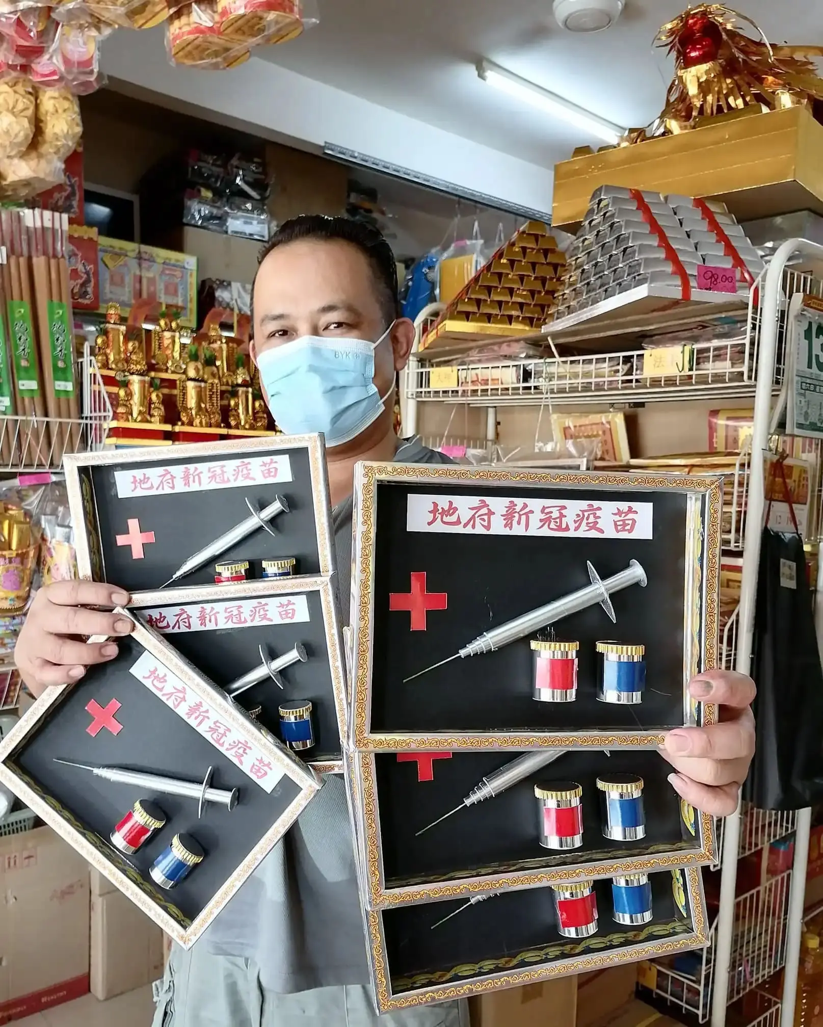 Hell COVID-19 vaccines at JB prayer paraphernalia shop