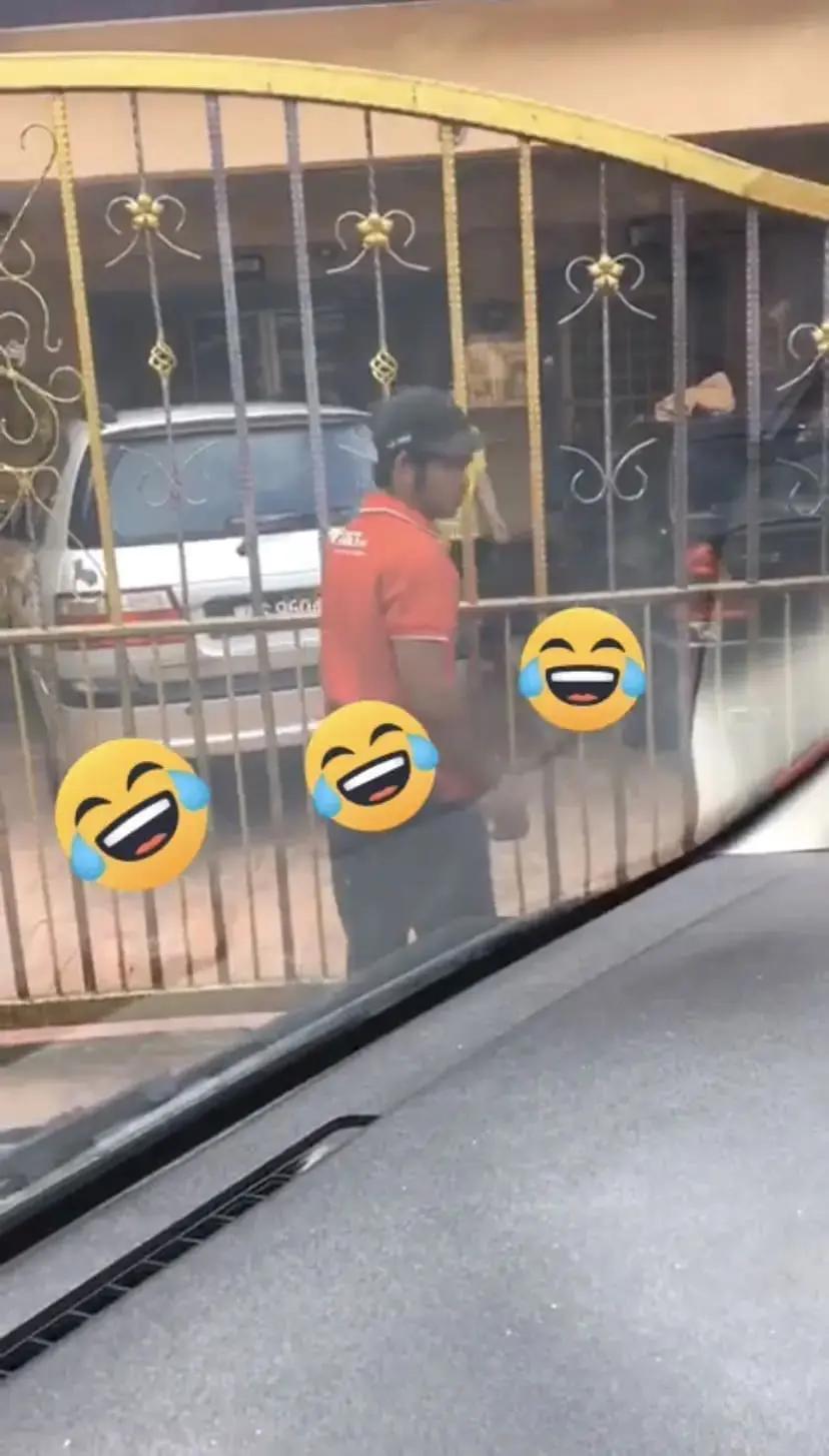 J&T delivery man going about his business sending a parcel to its destination.