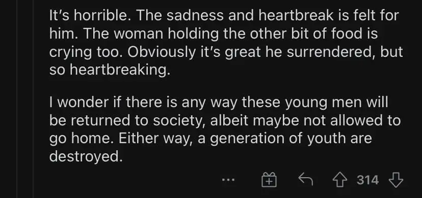 Russian soldier sipping tea and eating treated by Ukrainian comment 4