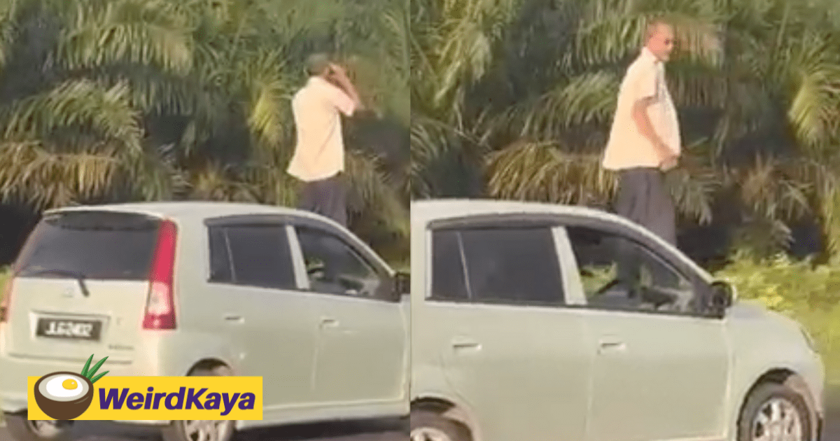 Uncle stuck in heavy Raya traffic climbs onto car bonnet and checks the road with binoculars