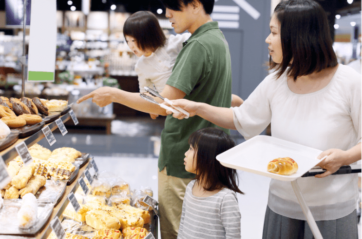 A family buying bread
