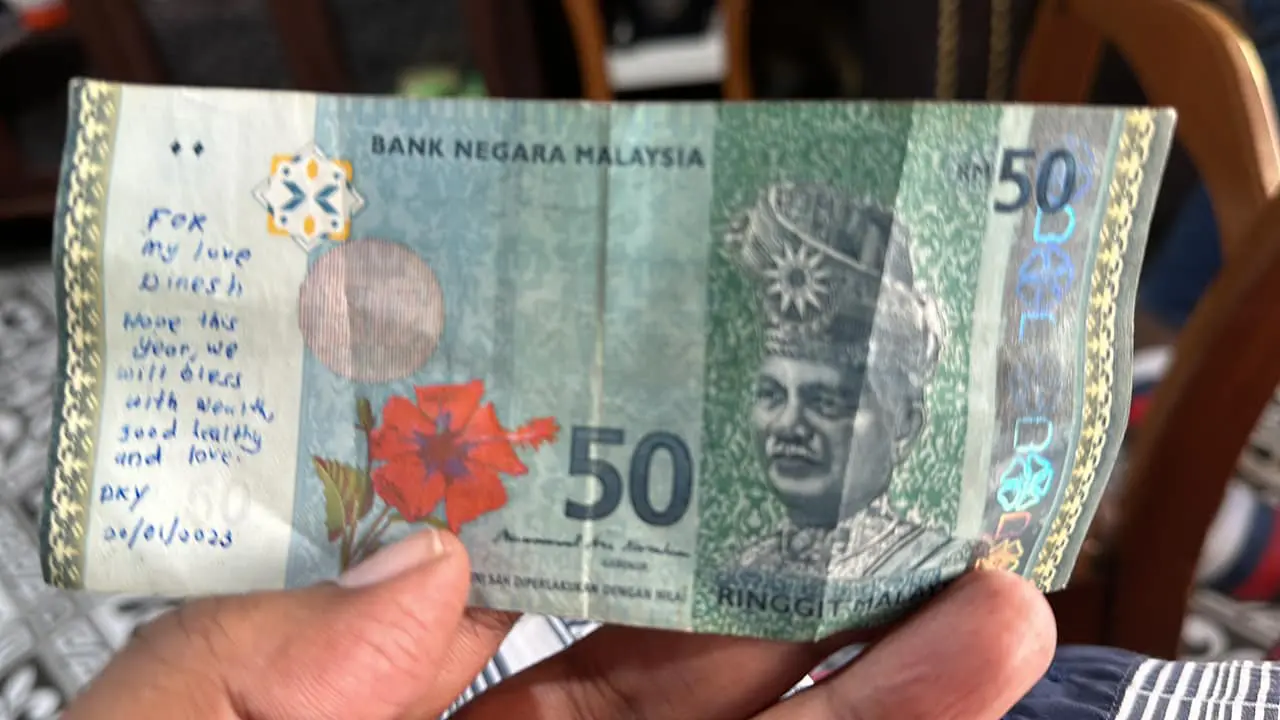 a love message written on a RM50 note
