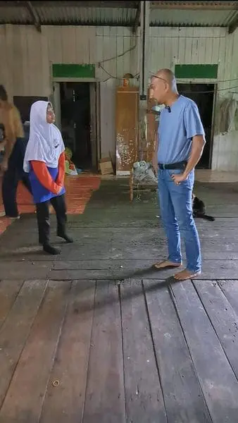 a man is talking to izara