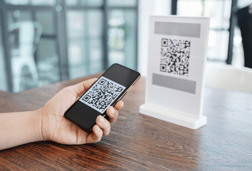 a man scanning qr code via phone