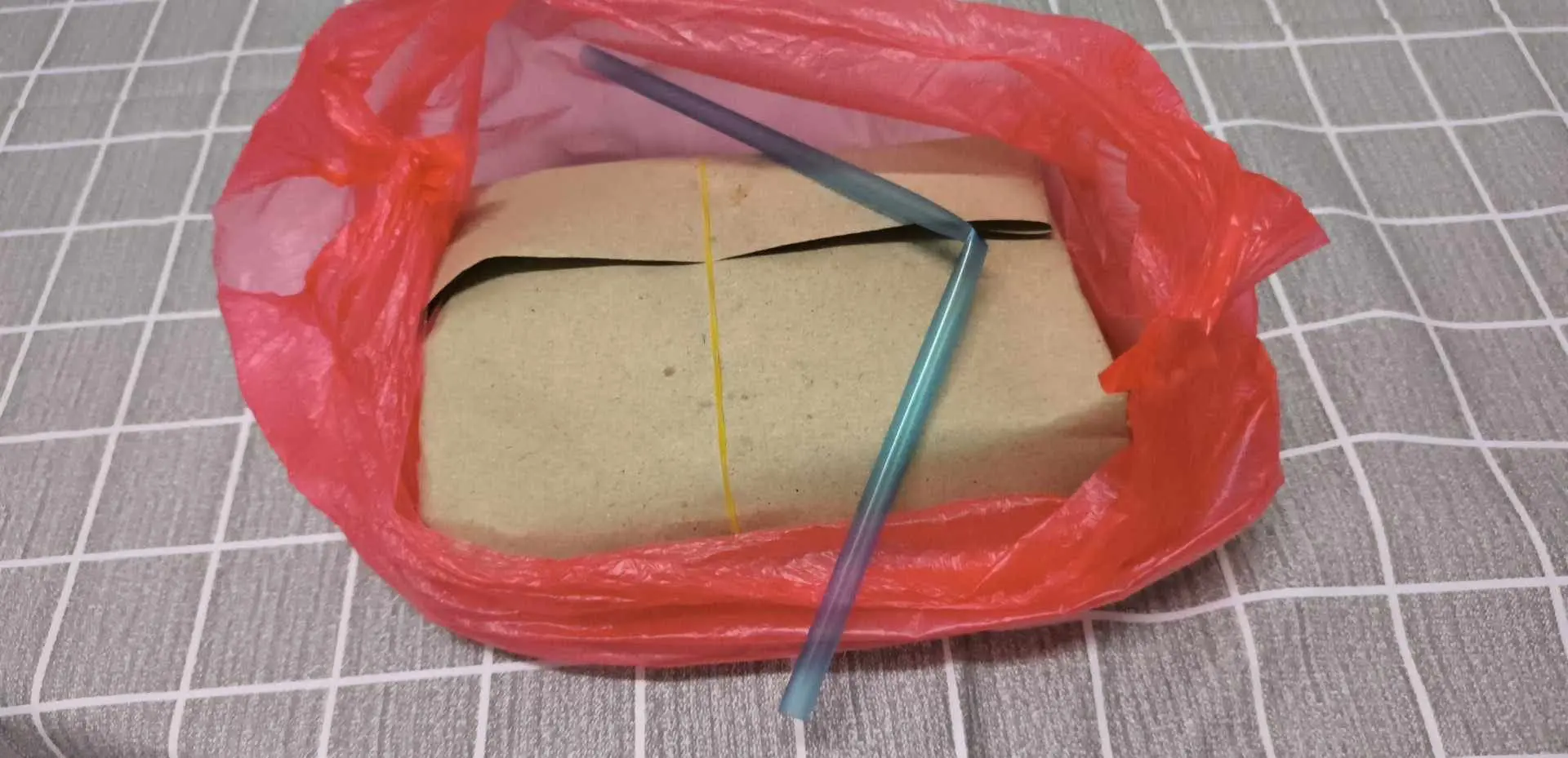 a packed meal with straw