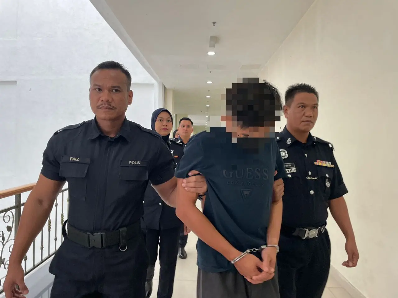 'Abang Bas' in handcuffs