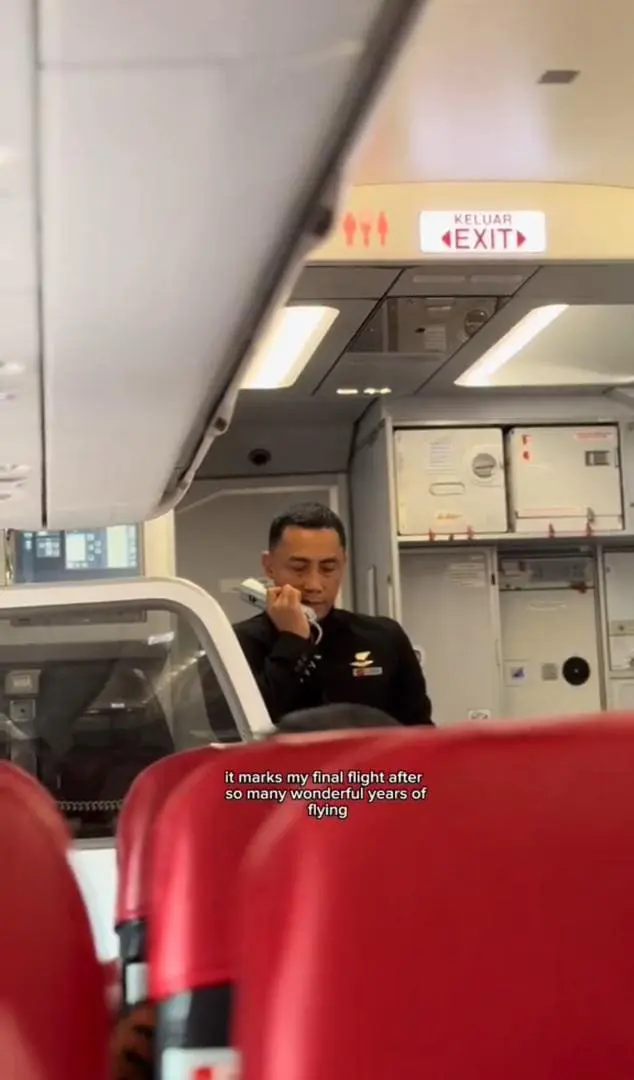 AirAsia cabin crew making his last announcement on board