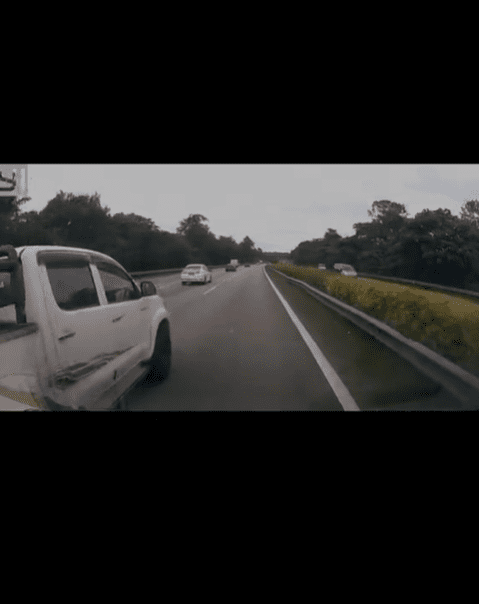 Ambulance overtakes Hilux on the highway