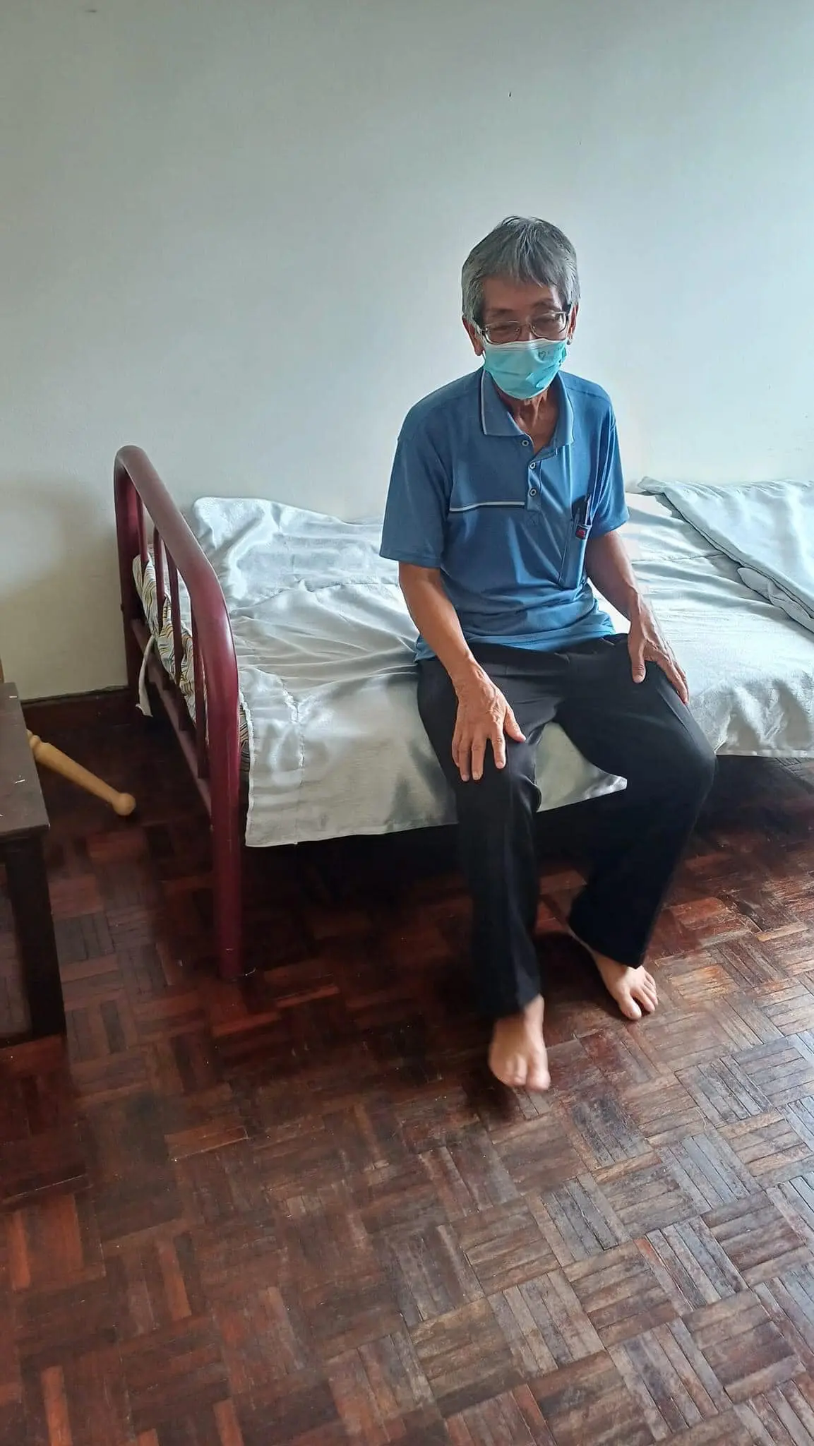 An Ge sitting on the bed