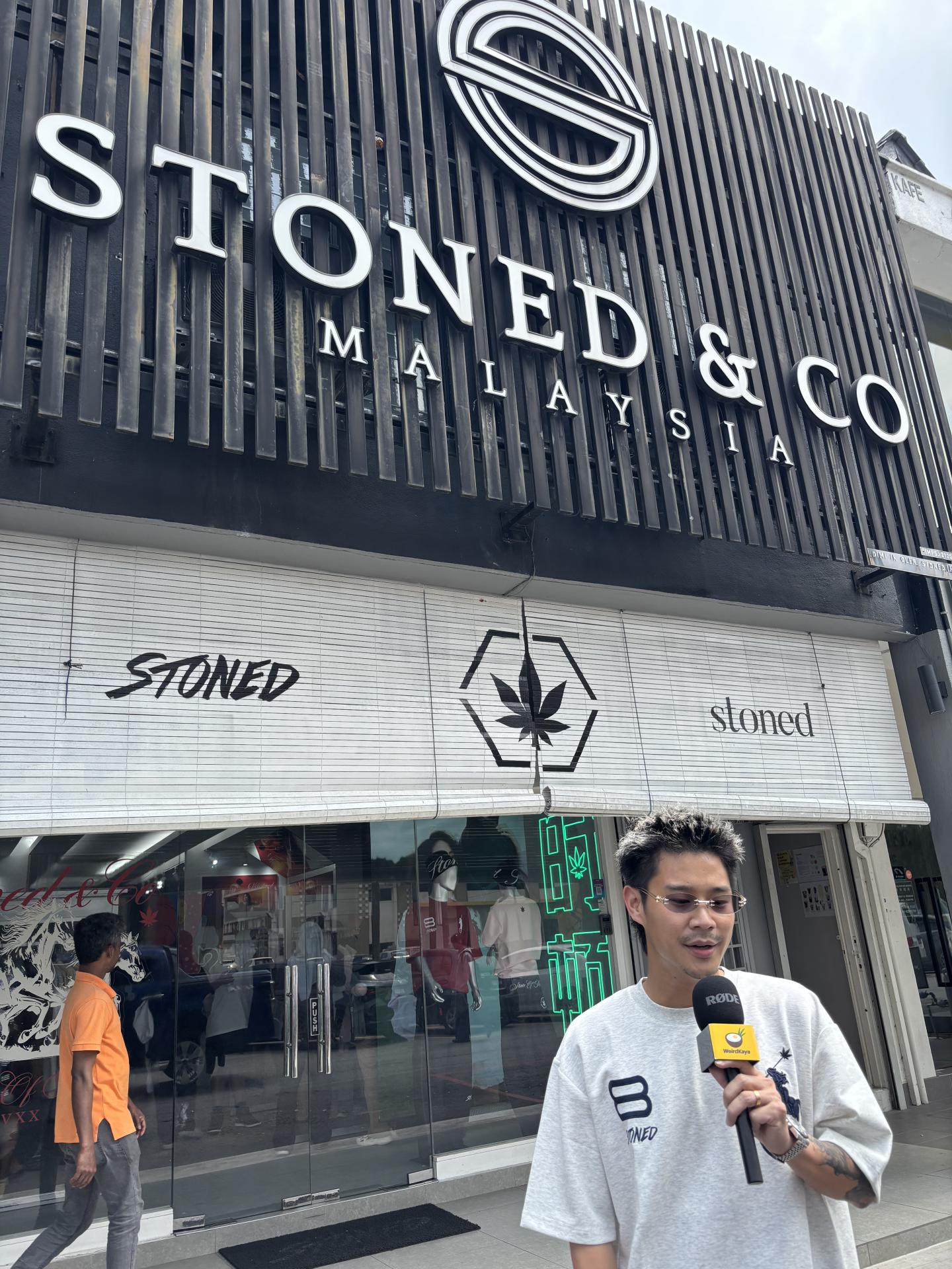 Andrew Ngo standing outside Stoned & Co store