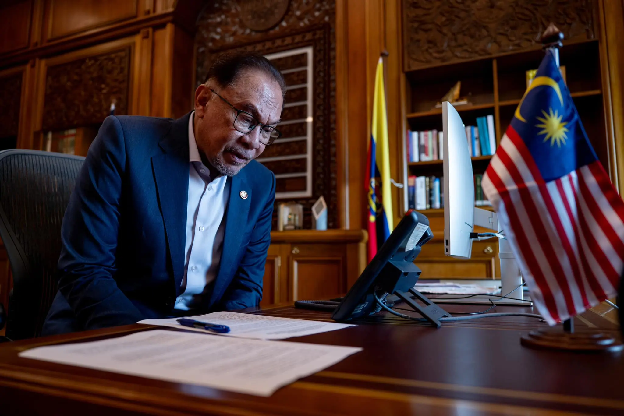 Anwar Ibrahim sitting inside his office