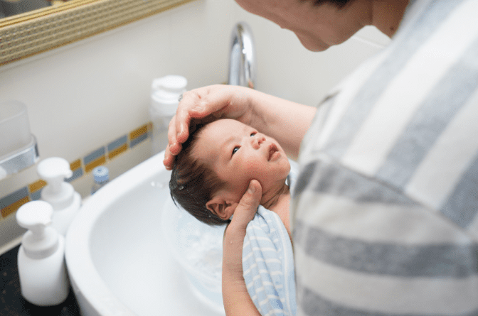 Asian woman holding a baby