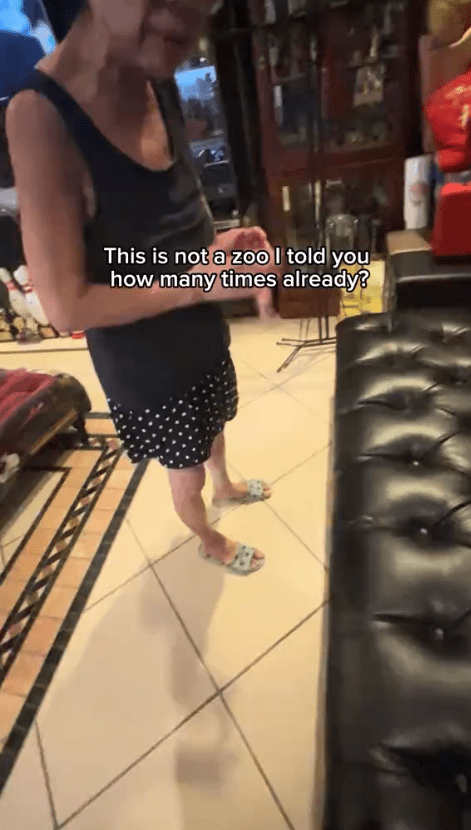 Asian mom scolding her son