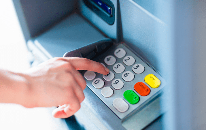 A person using the ATM machine