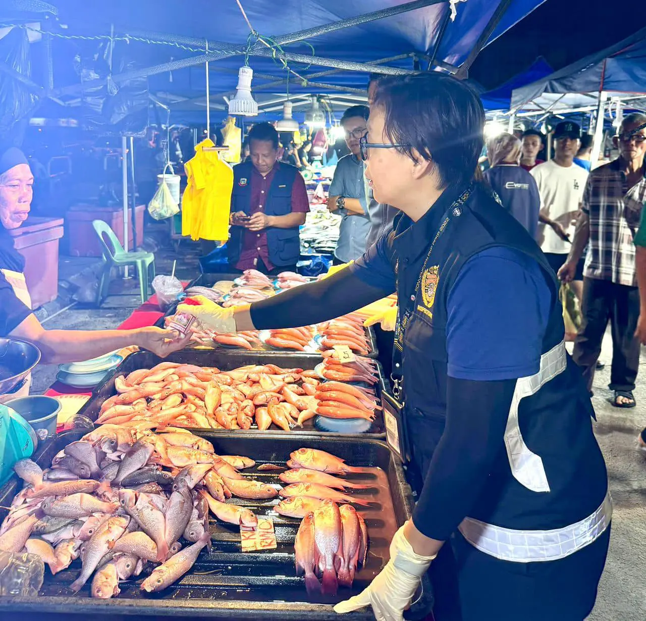 authorities conducting investigation at a night market