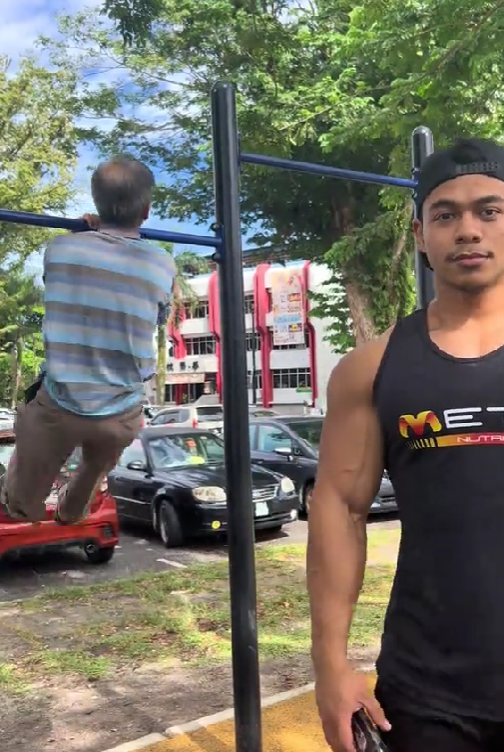 azzam with uncle doing pull ups with one arm