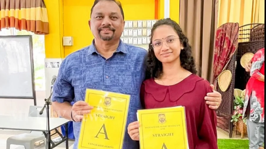 Baskaran with his daughter