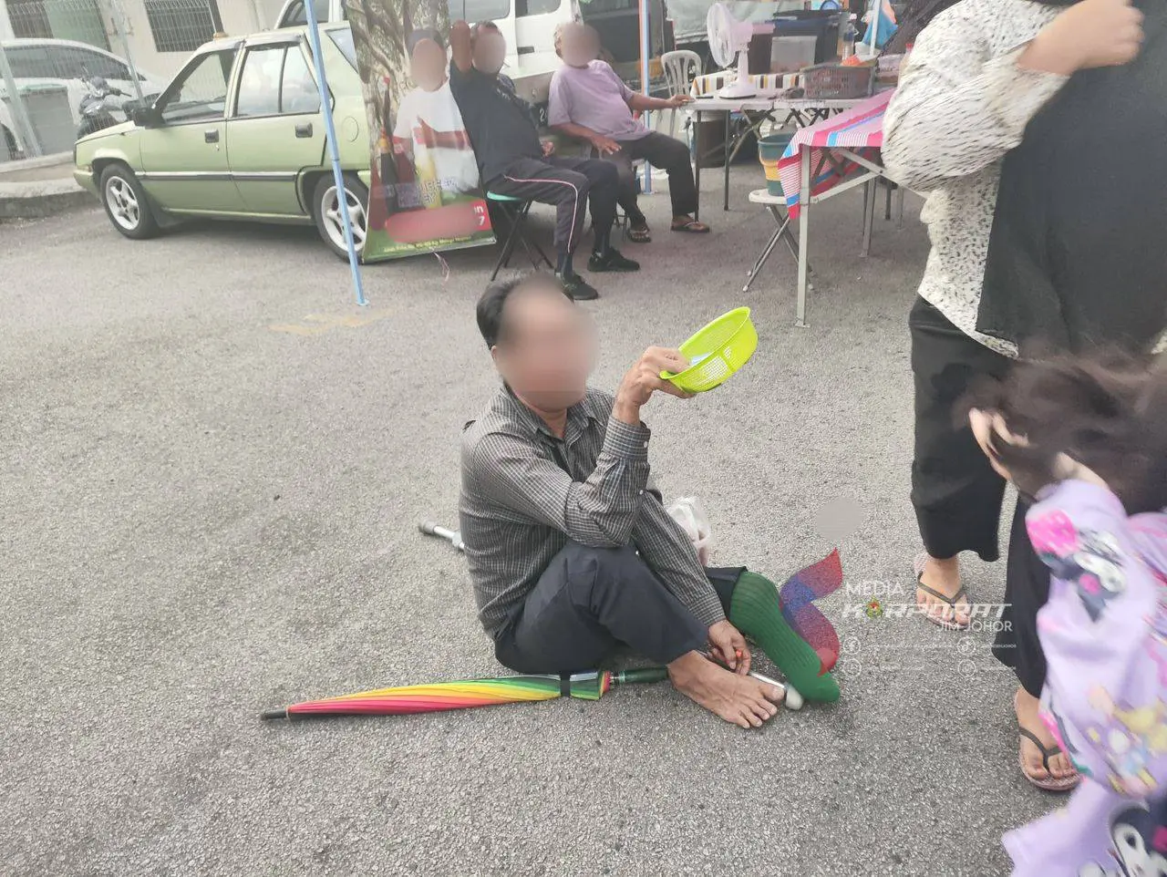 Beggar at Johor night market 2