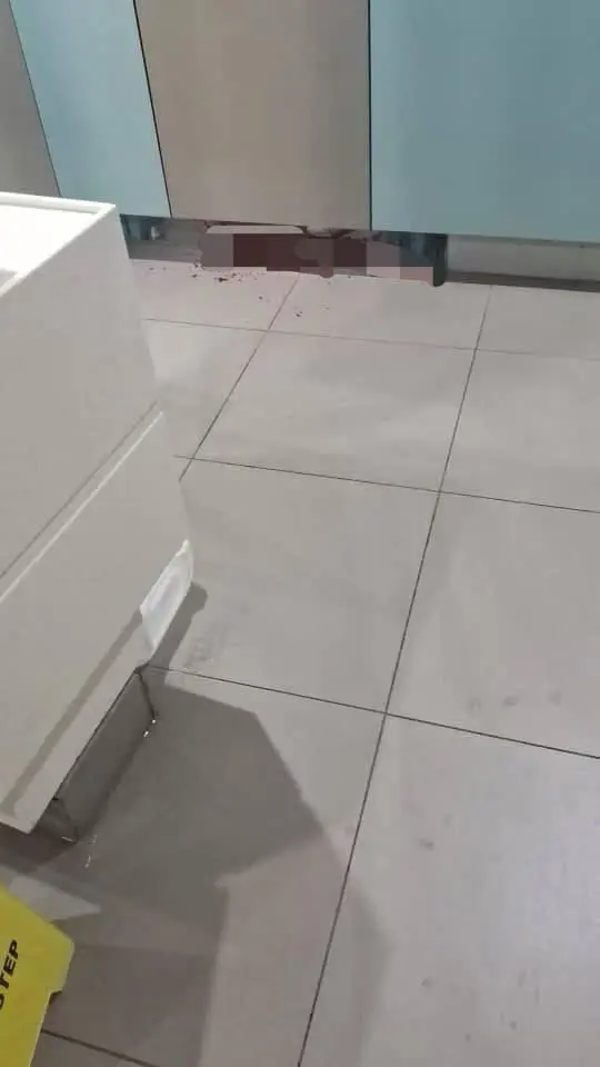 Bloody shoes and body inside JB mall toilet