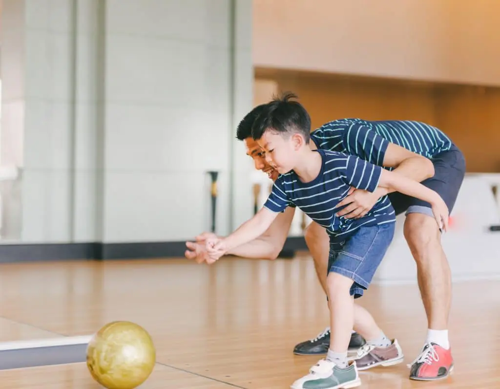 bowling with father and son.