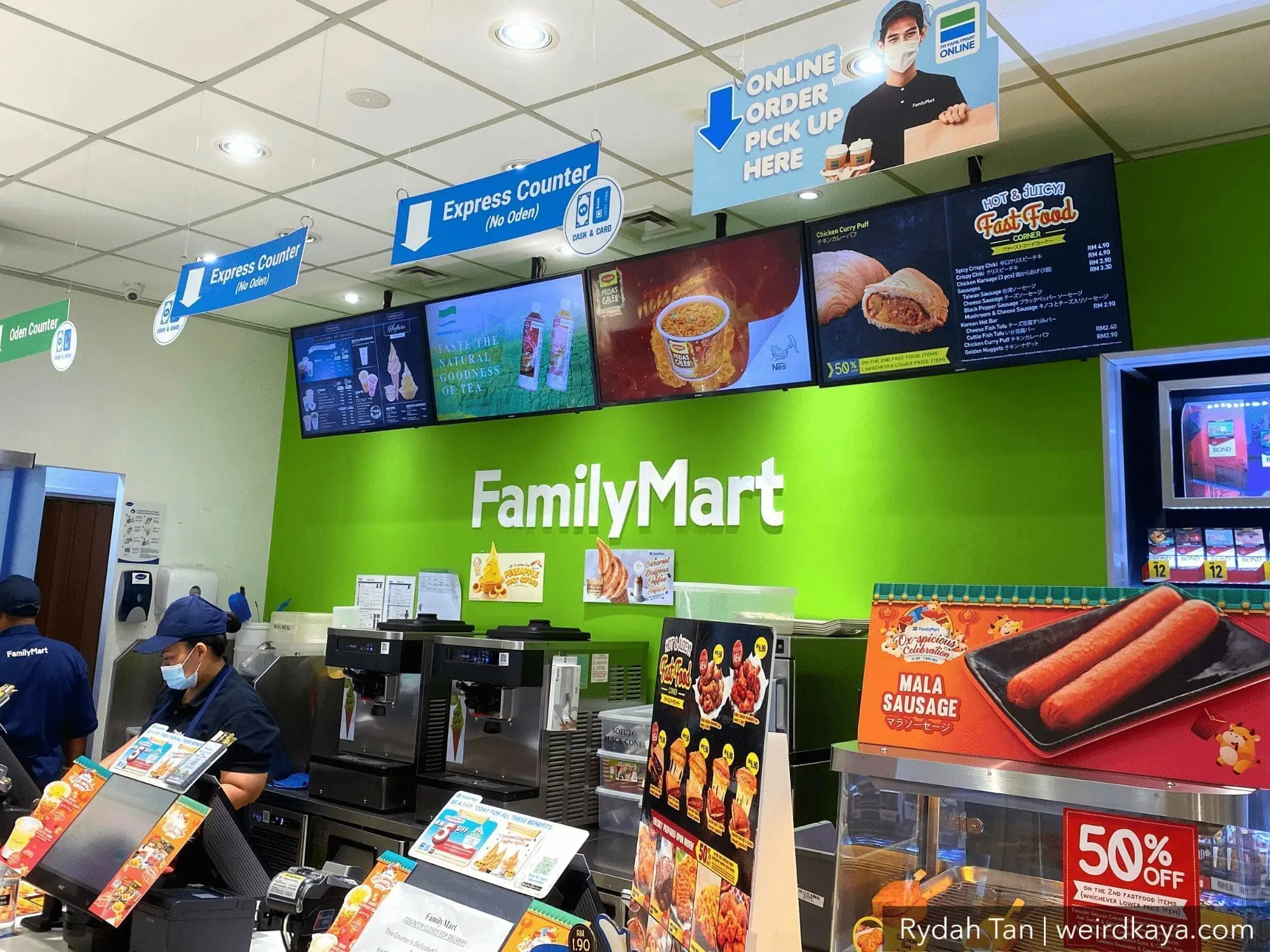 A cashier doing her job at a Family Mart store