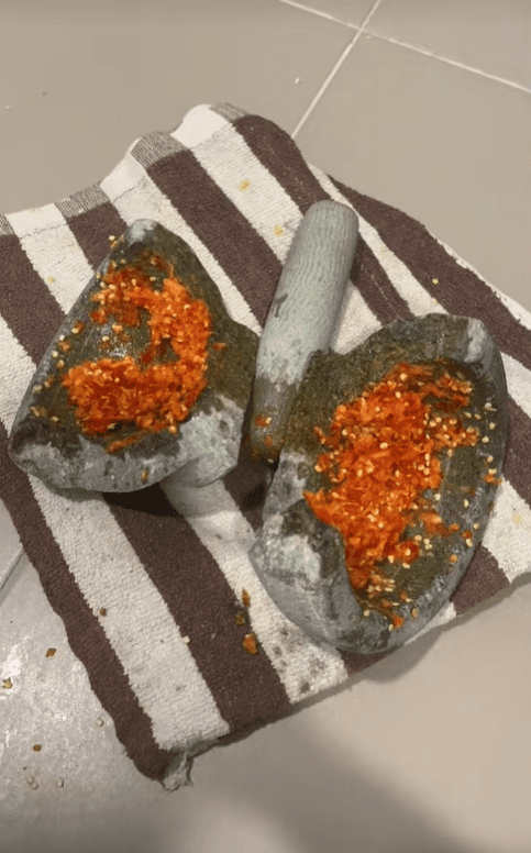 Broken stone mortar while making sambal