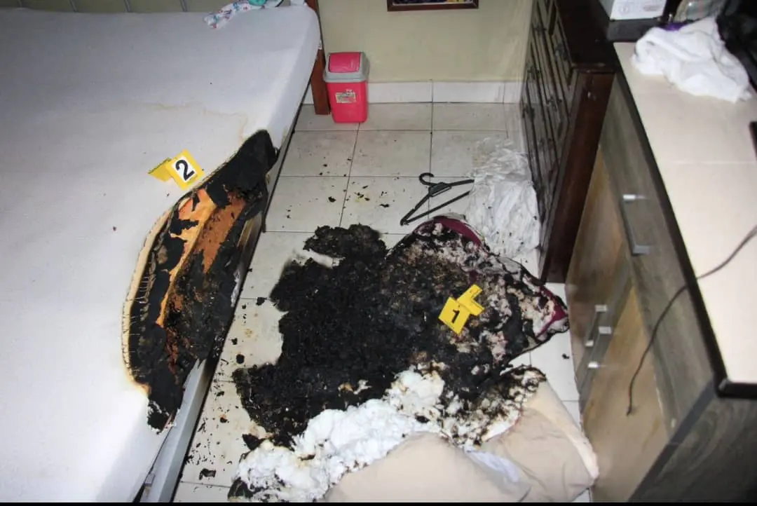 burned mattress and pillow in a room