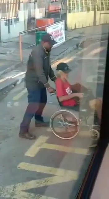 bus driver helping oku passenger