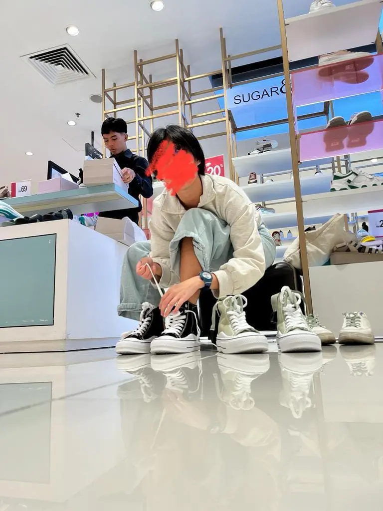 Author's sister buying shoes