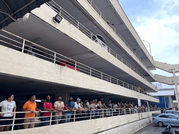 Bystanders trying to look at scene of man's split body