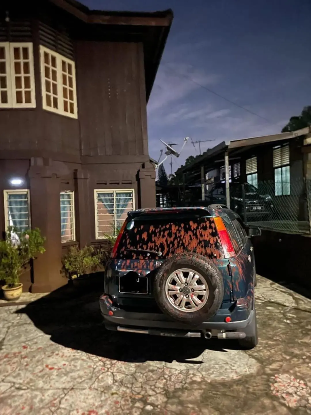 Car damaged by red paint in Johor