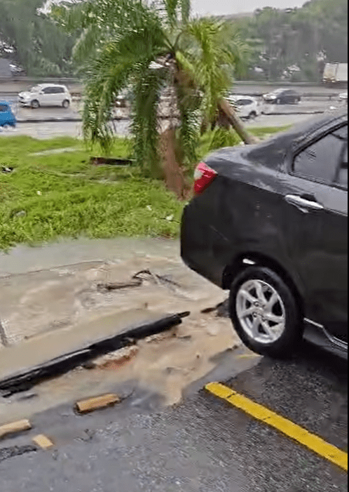 Car dangling at the roadside