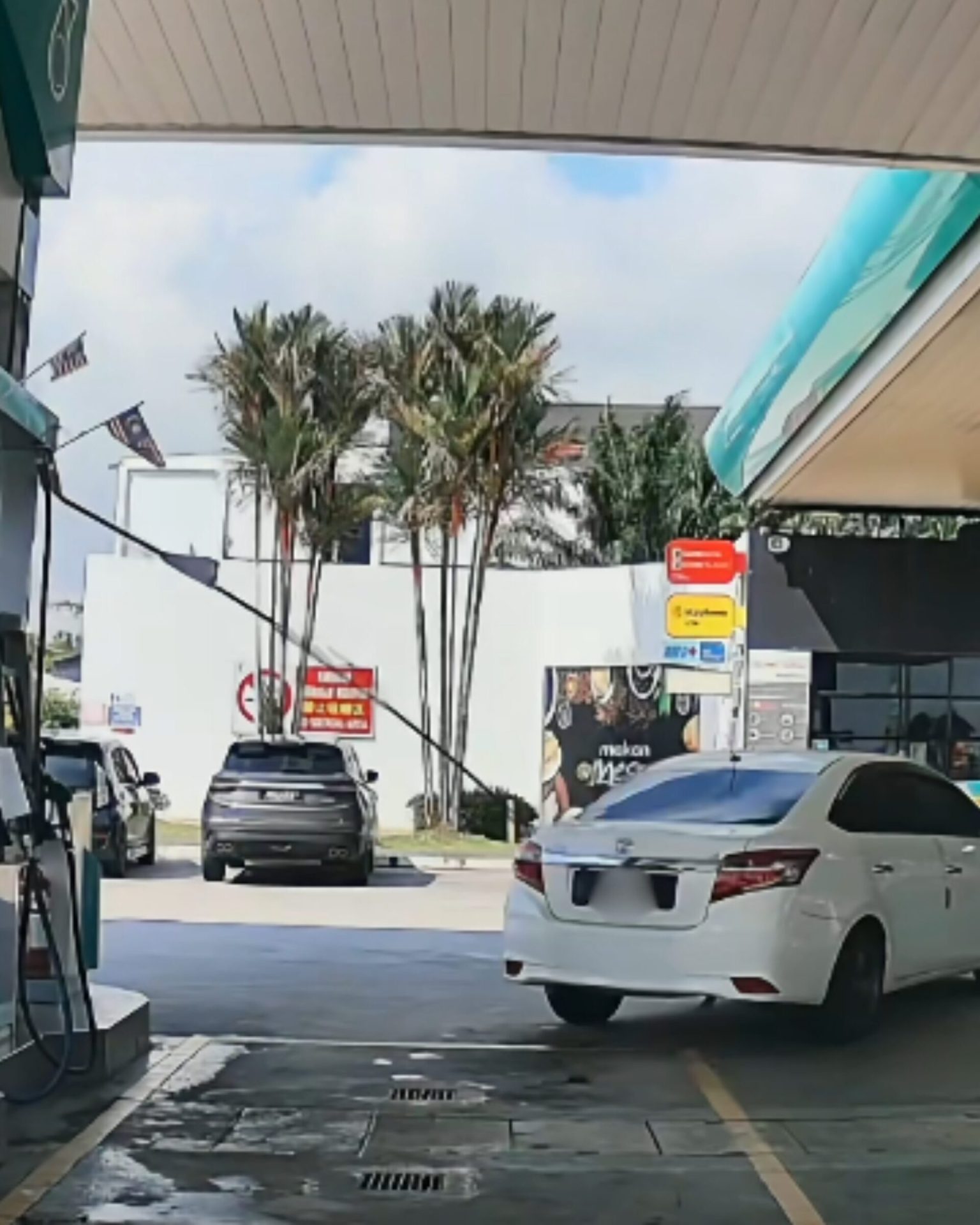 Car driving off with nozzle