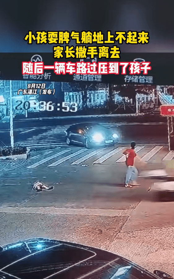 Car heading towards boy lying on the road in China