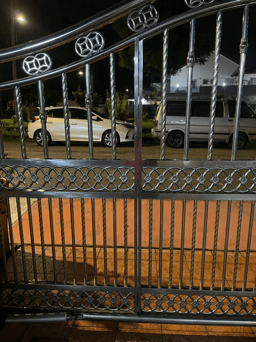 Cars being parked outside of a house in Cheras