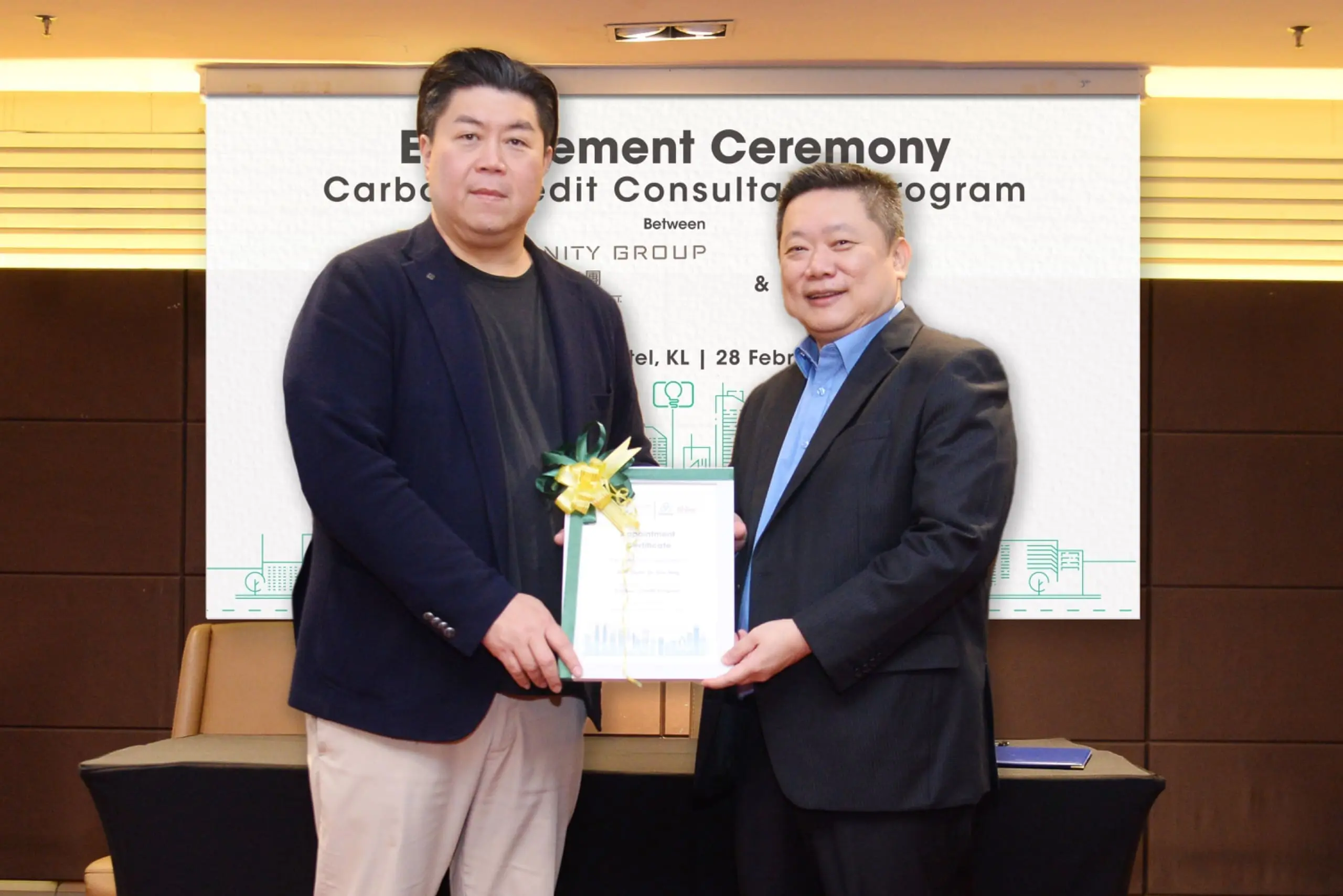 Chairman & CEO of Unity Group handing over the Appointment Certificate to Professor Datuk Dr. Eric H’ng