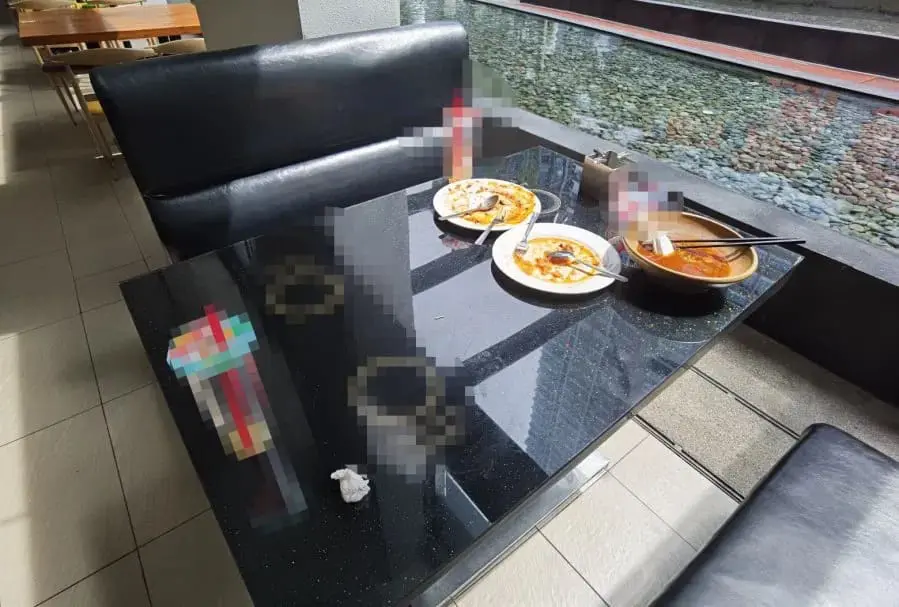 China woman stabbed restaurant leftover table