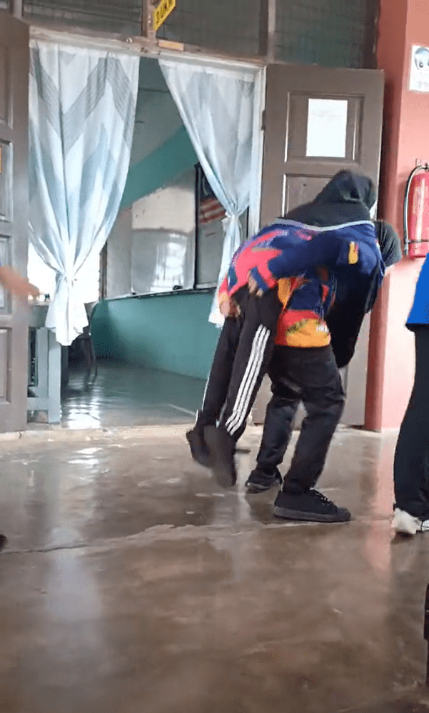 Classmate piggybacks OKU girl